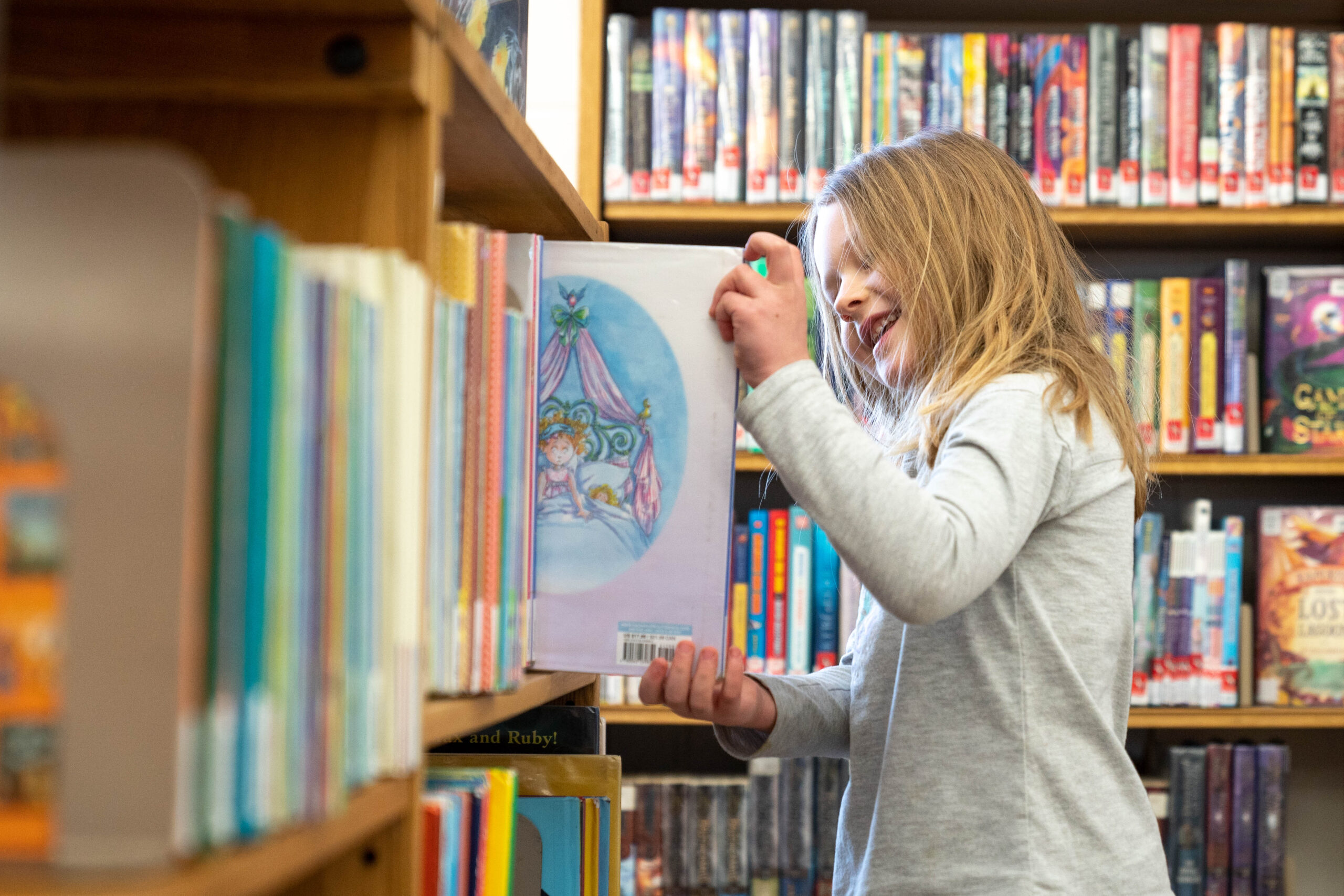 A child reading in the Duluth Public Library